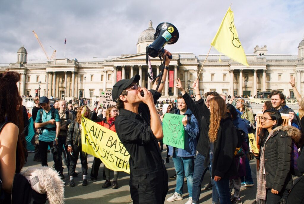 Photo of protesters at Trafalgar Square on a sunny day