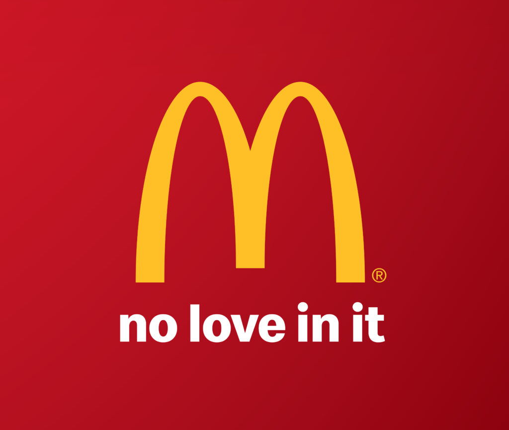 McDonald's logo subverted with the slogan 'no love in it'