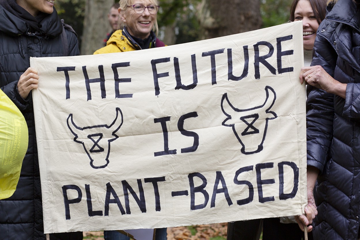 People holding the Animal Rebellion banner "The Future is Plant-based"