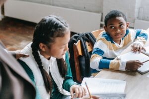 School pupils, one of them looking at the reader.