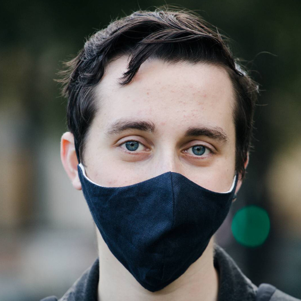 Photo of Dillon Parsons wearing a black face mask